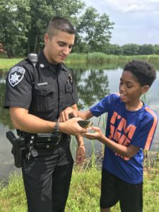 Deputy Sohotra and student holding a fish
