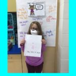 elementary students show drawing of how they show respect