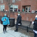 a group of elementary students outdoors enjoying hot cocoa