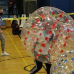 principals do a sumo bubble tournament in the gym