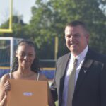 Principal Reardon and 8th grade graduate