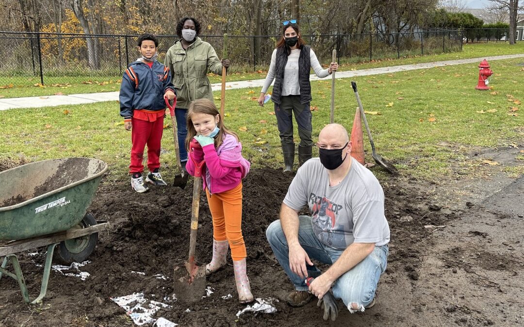 Families Help Tend to School Garden